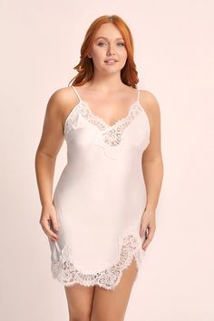 Indulge in the elegance of our Sian Lace Slip, crafted from luxurious silky white satin with a touch of stretch. The bias cut design hugs your curves beautifully, while adjustable spaghetti straps and a v-neckline, adorned with delicate cotton lace adding sophistication. Perfect for special occasions or a moment of self-indulgence, this slip makes you feel like a goddess. Its ethereal beauty and comfort will have you wanting to wear it again and again. Embrace the allure of the Sian Lace Slip an