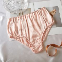 Meet our french cut silk panties. They speak the language of modest sophistication and je ne sais quoi. This re-emerging high-cut style emphasizes your waistline and elongates the lines of your legs. It is particularly friendly for those who are a pear or hourglass body shape. Designed in Toronto.  Material . 100% mulberry silk . 22 momme (600 thread count) . Silk charmeuse Gentle hand washing . Soak in lukewarm water with mild detergent for no longer than 30 minutes . Do not rub or wring. Gentl