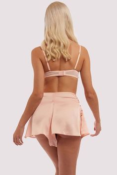 Also known as tap-pants, the peach french knicker is ideal for the more feminine 50s styles of circle skirts and flared dresses. The French knickers are made in a luxurious chartreuse satin, featuring a 5-button opening on the side for ease of slipping on. The waist is fitted and the shorts are gathered to flare out at the legs.