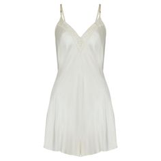 This teddy slip was made in the 1940s and displays many signature details of the era’s lingerie. It has the coveted war time CC41 label and is tailored from cream satin with coordinating spaghetti straps. It has a nipped-in, inverted empire waist and highly flattering bias cut. A chance to put a twist on the slip-dress trend, the modesty-protecting shorts make this a piece you’ll want to wear outside of the bedroom. Edged in cream lace trim accented with delicate pink and blue flower and bow emb